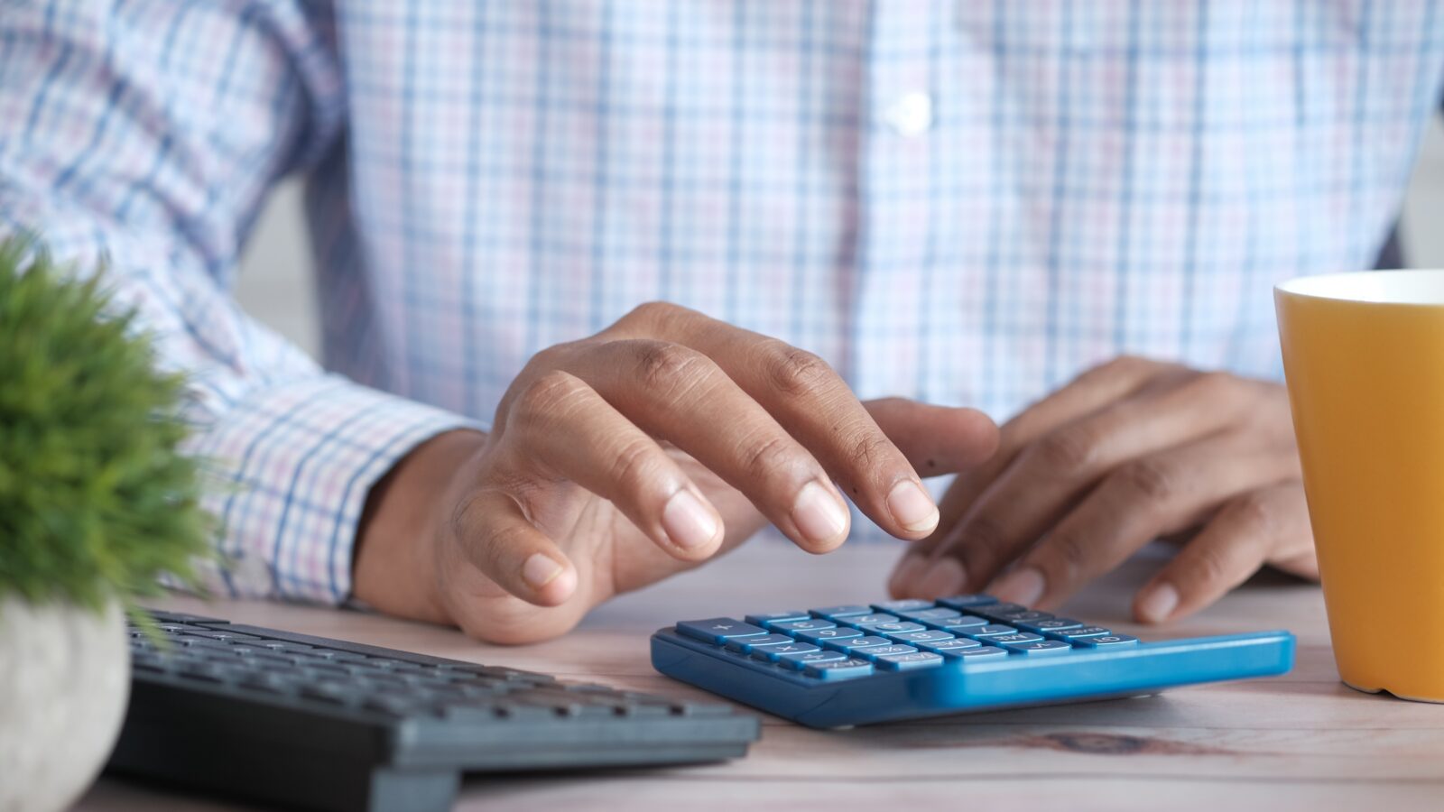 Man using calculator representing prejudgement interest in family law cases